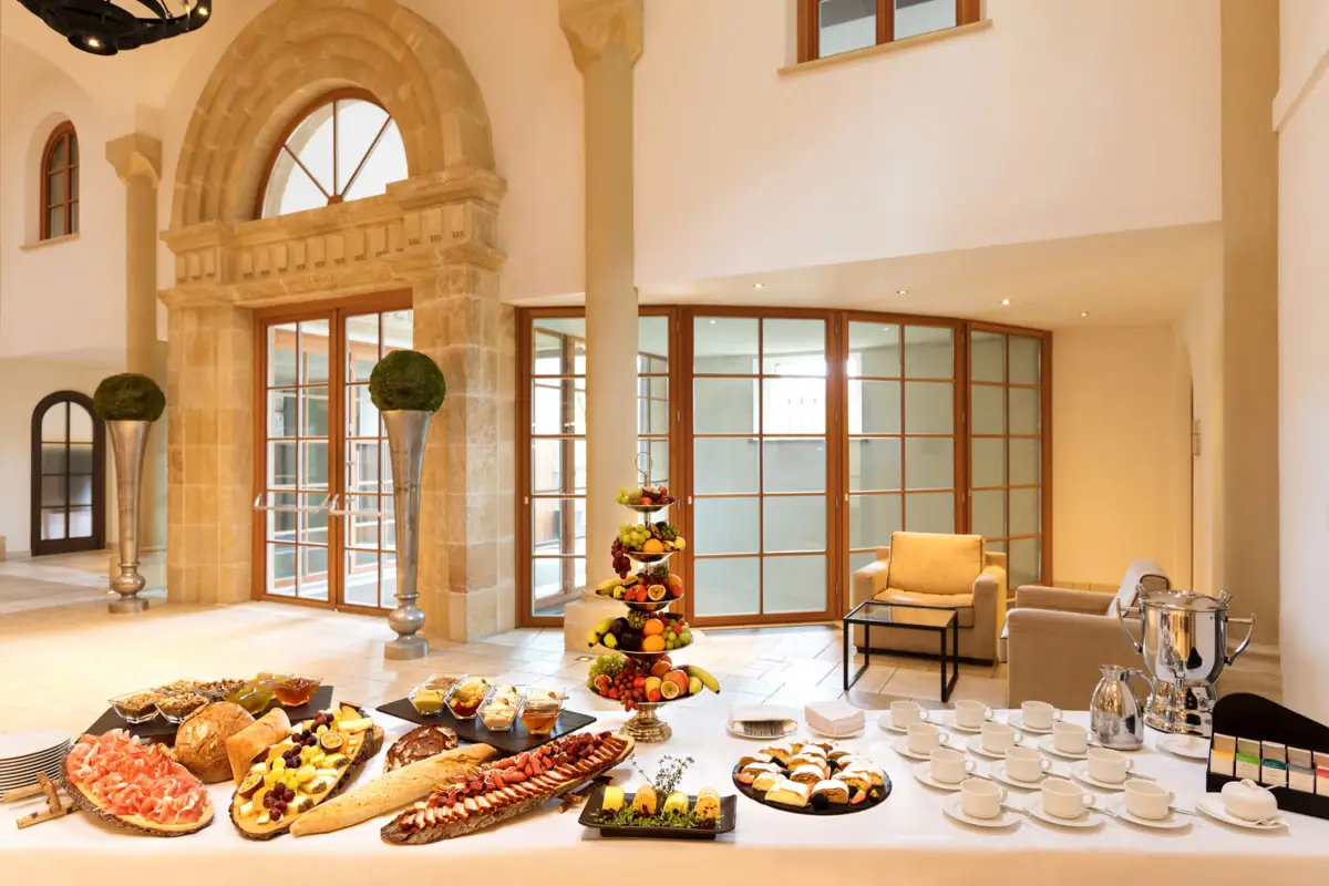 A table with various dishes of food indoors.