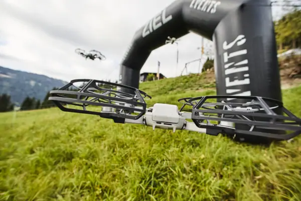 A drone flies over a field.