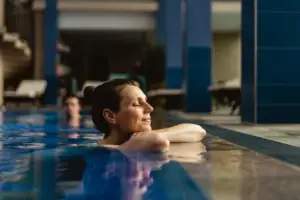 A woman swims in a pool.