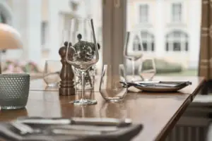 A table with empty wine glasses.