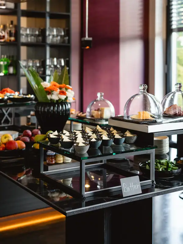Buffet table with an assortment of food and drinks.