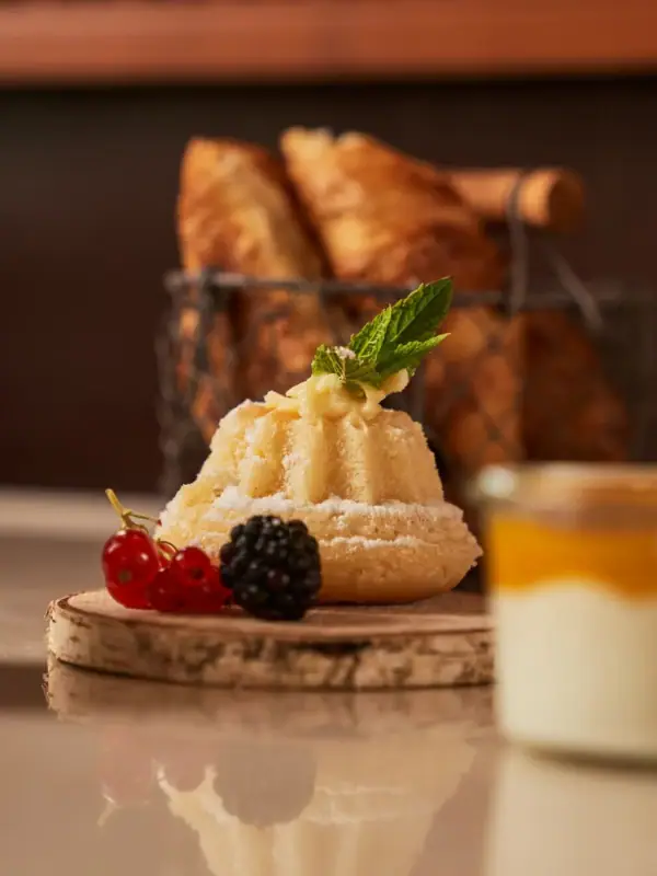 A dessert garnished with strawberries on a plate.
