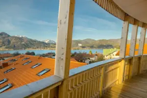 View from the balcony View of a lake from the wooden deck of a house