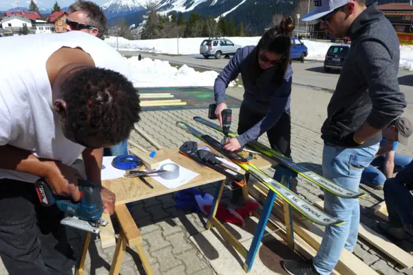 A group of people working on skis.