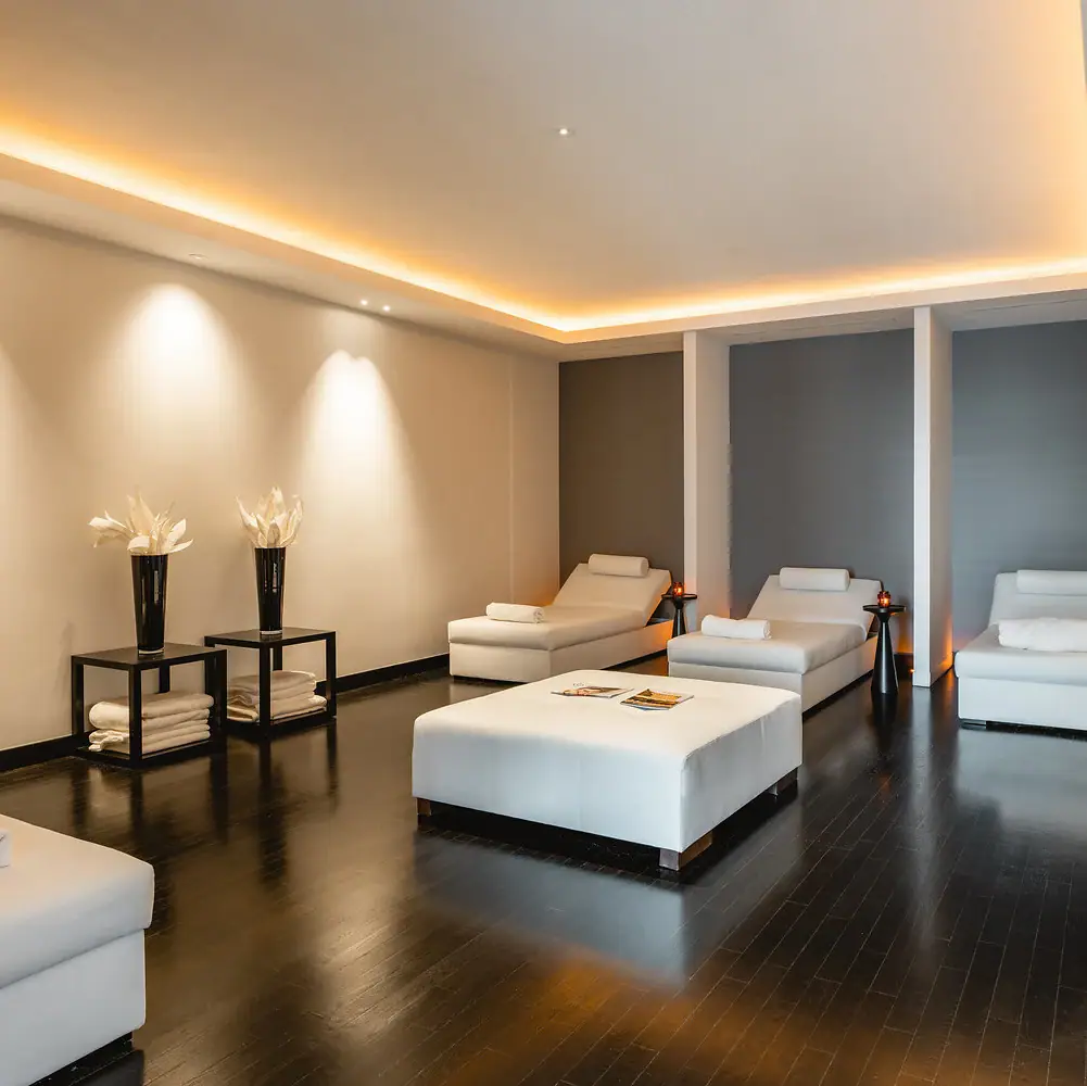 Relaxation Area A room with white furniture and a fireplace.