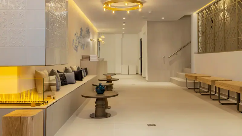 spa lobby A room with a bench and tables.