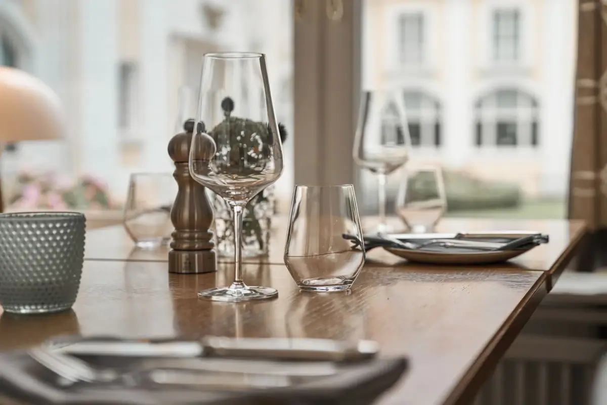 A table with empty wine glasses.