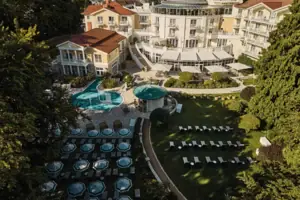Aerial view of a building with two pools