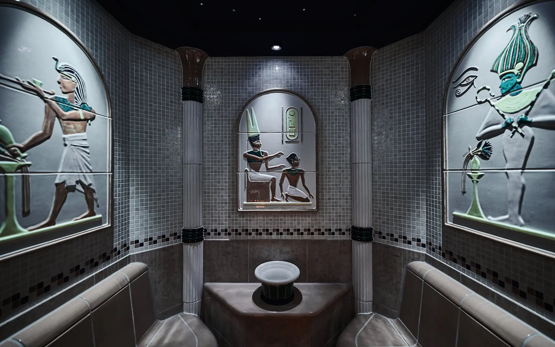 Steam Bath Steam room with a sink and art at the walls.