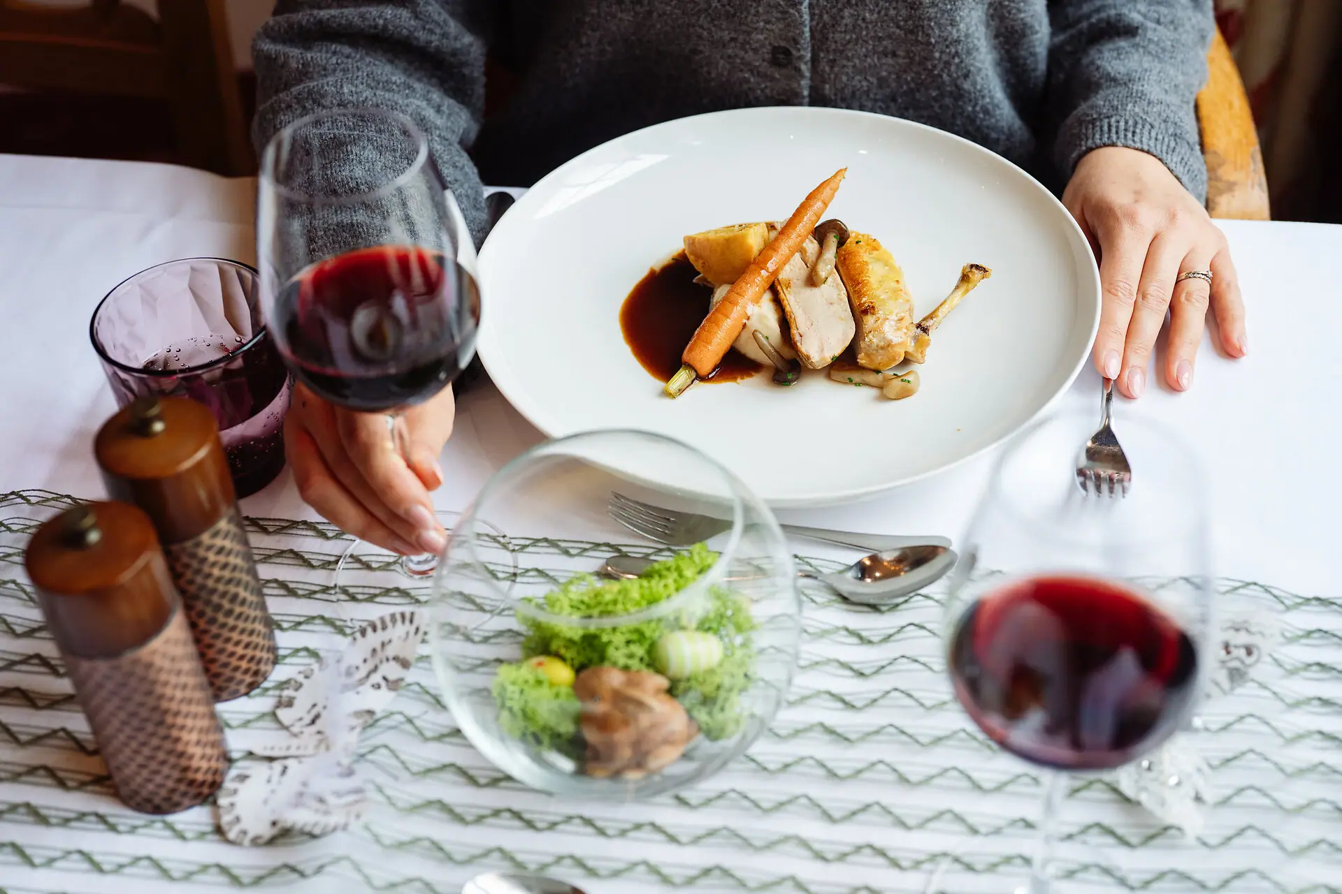 A person is holding a plate of food.