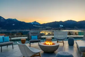 Fire pit with chairs and a view of the mountains in the background