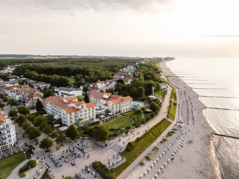 Aerial view of a beach with buildings and trees.