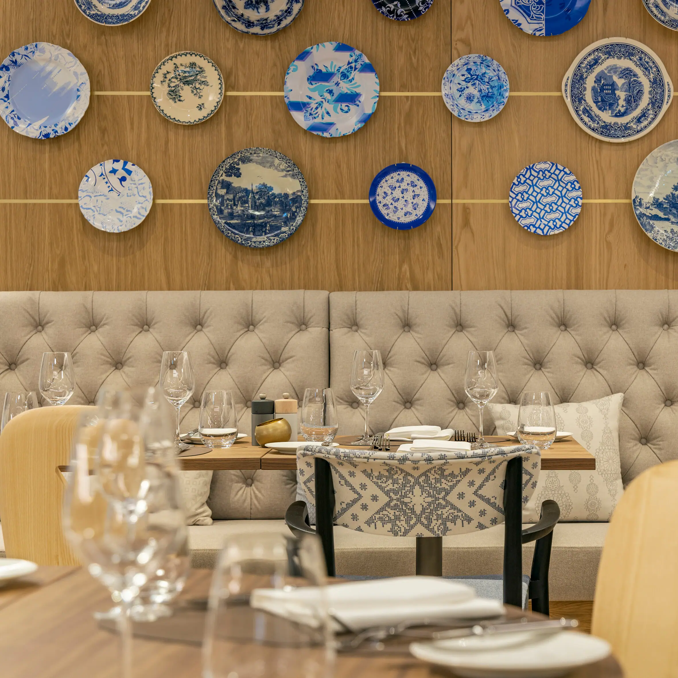 A restaurant with blue and white plates on the wall.
