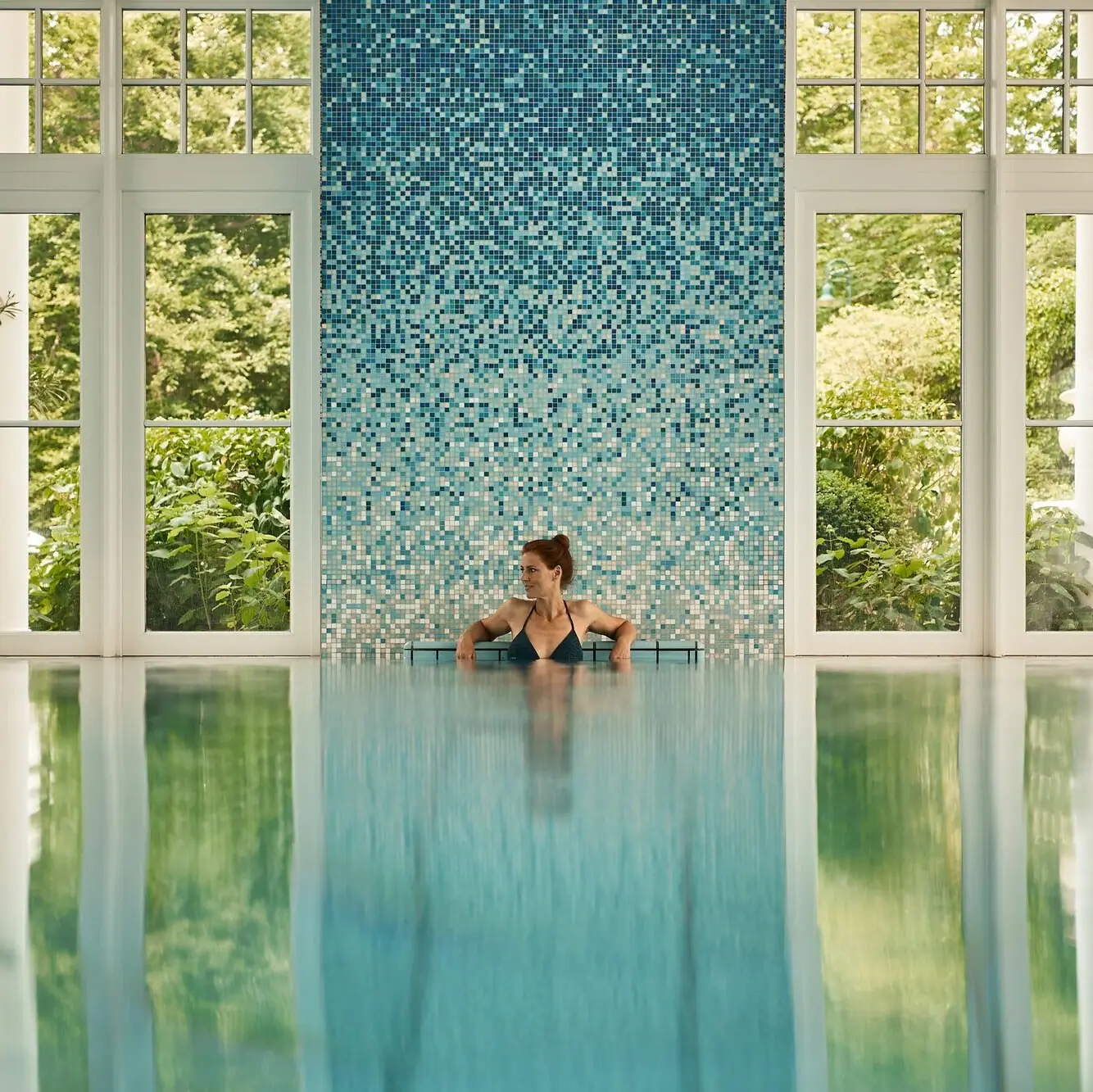 A woman swimming in a pool.