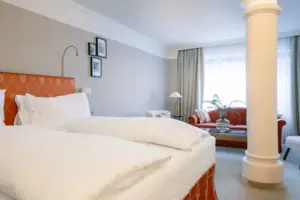 A room with a bed and a sofa.