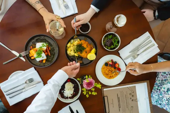A group of people are eating at a table.