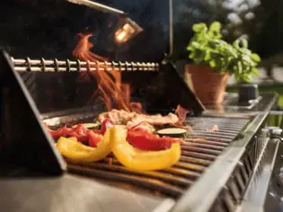 Eating on a grill with flames.