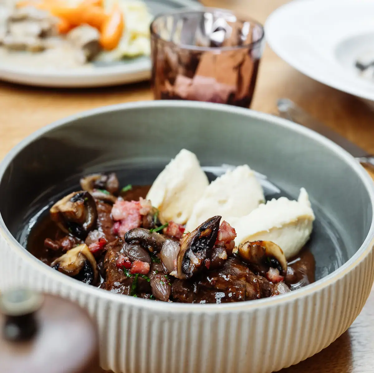 A bowl of food on a table.