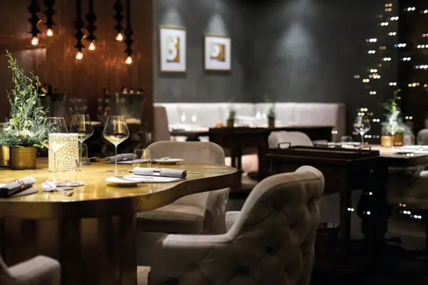 A restaurant with tables and chairs.