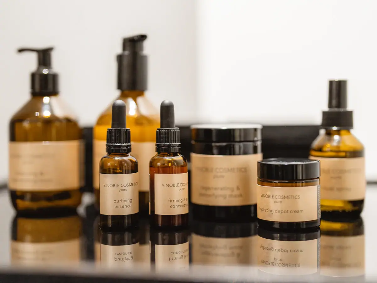 A group of glass bottles containing cosmetics.