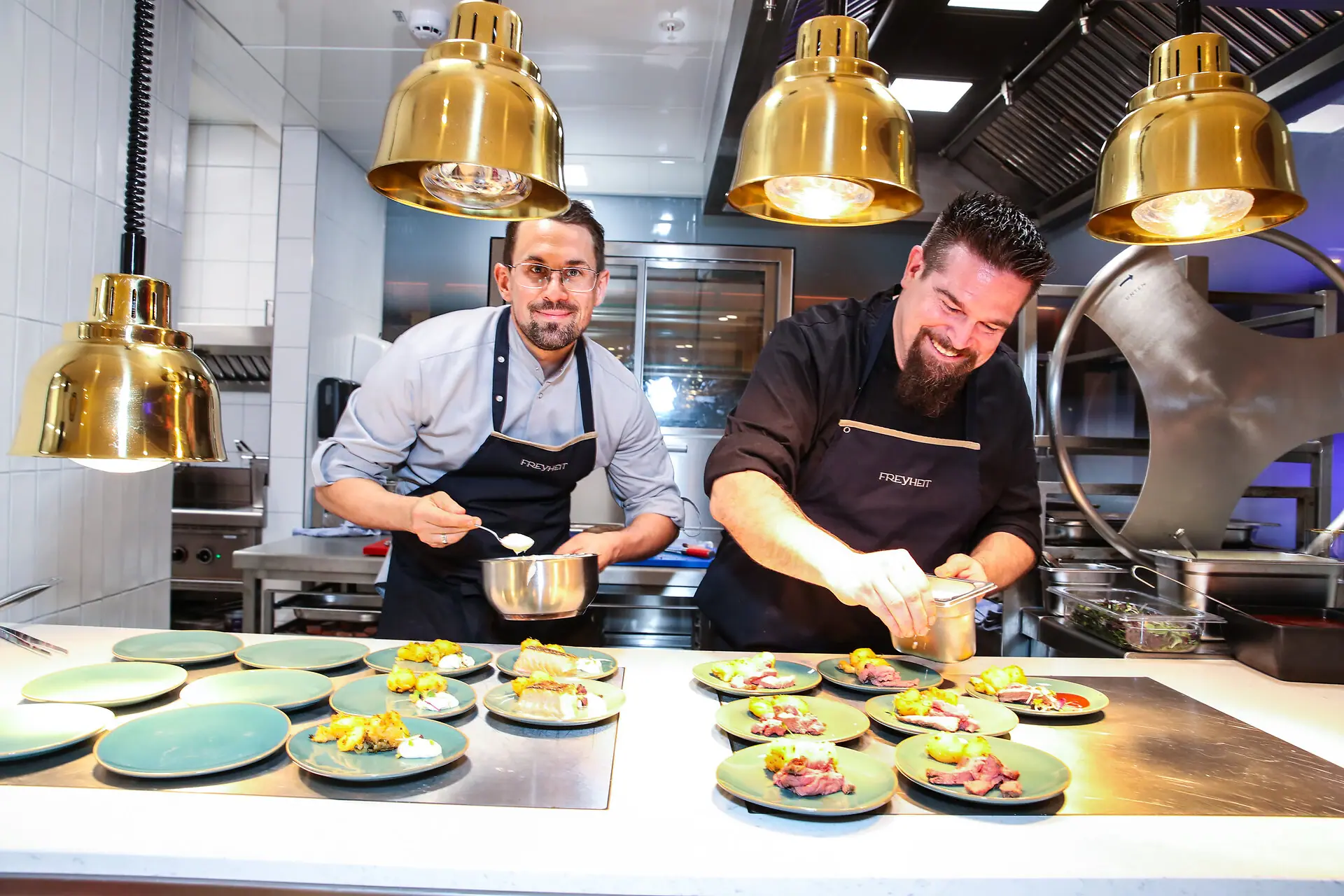 Two men in a kitchen.