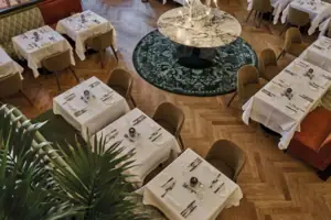 A restaurant with tables and chairs.