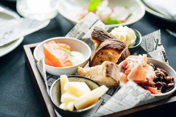 A tray of assorted cuisine on a table.