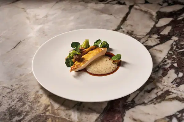 Fine dining dish at the Straubinger Grand Hotel Bad Gastein, combining Alpine cuisine with French sophistication.