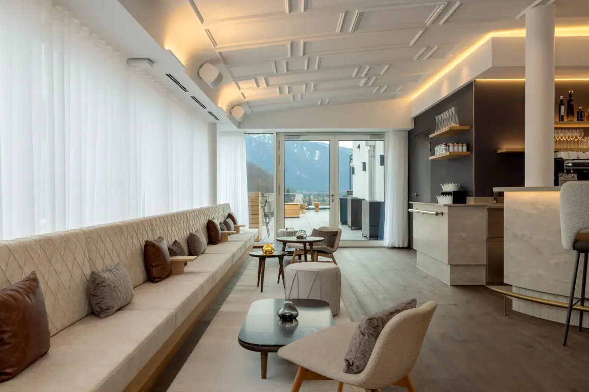 bar inside A room with a sofa and tables.