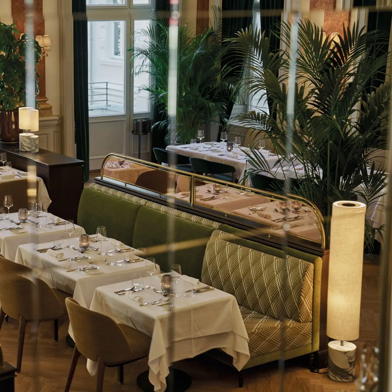 A restaurant interior with tables and chairs.