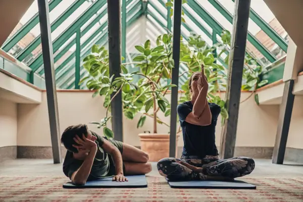 Man and woman doing yoga