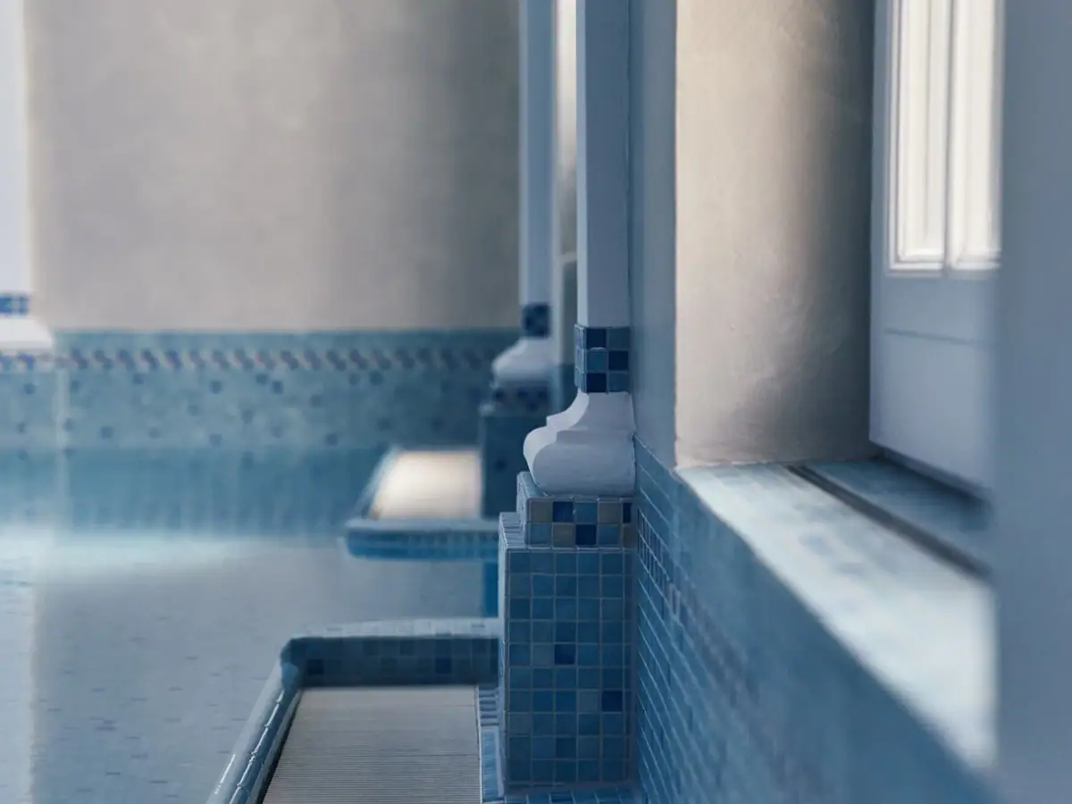 A row of blue tiles on a wall.
