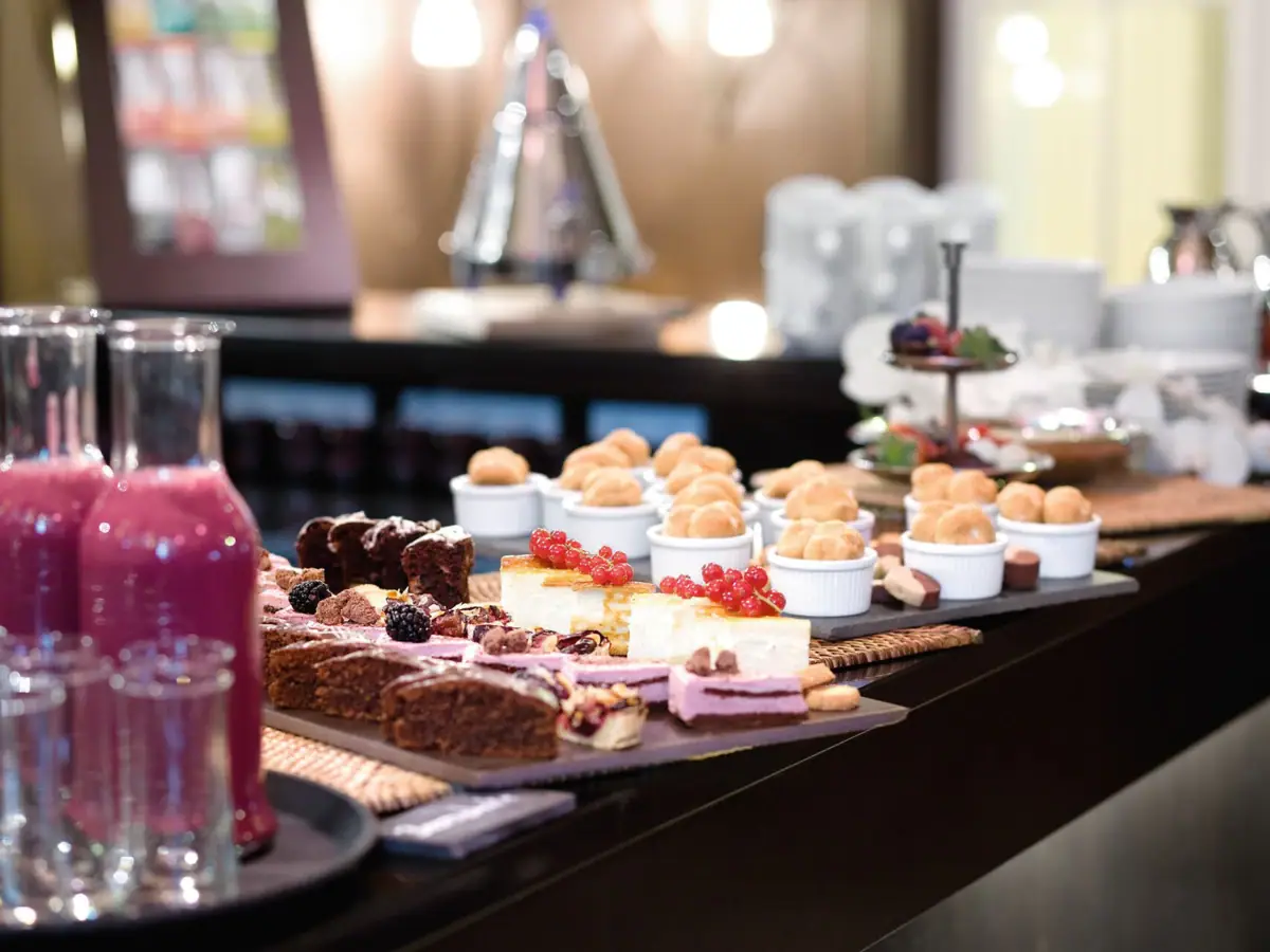 A table set with various foods and drinks indoors.
