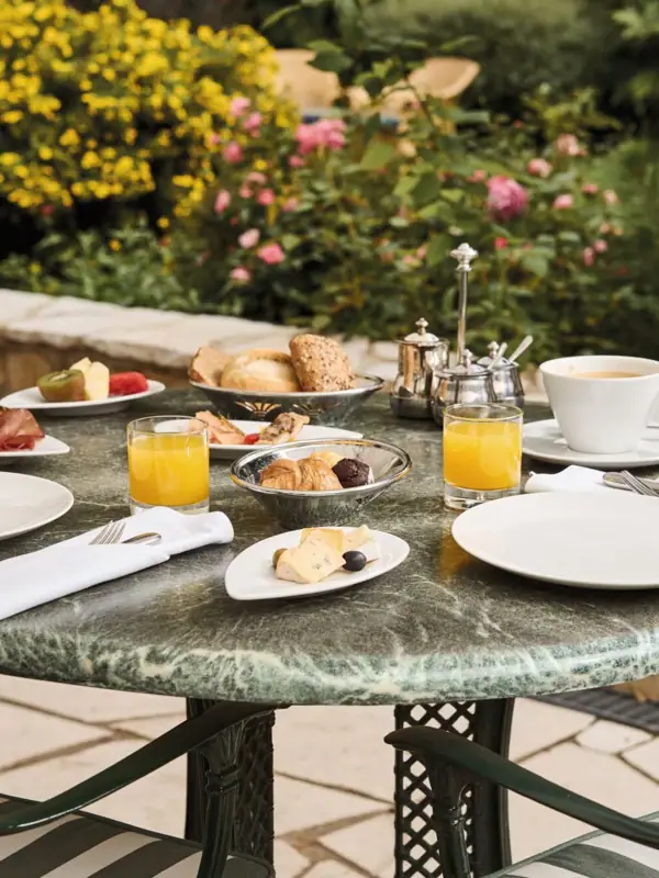 A table set with various dishes and tableware.