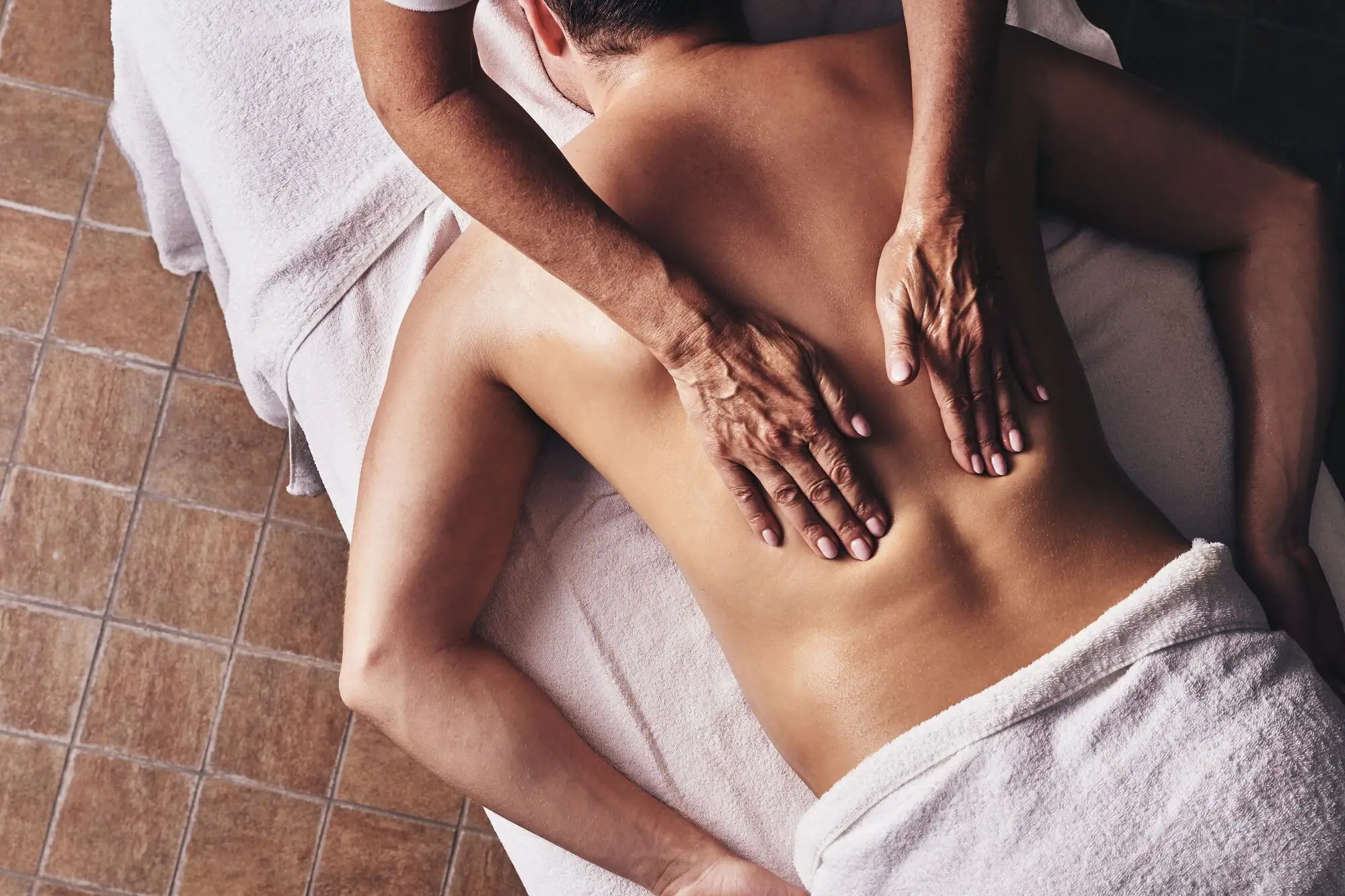 Massage A person receiving a back massage.