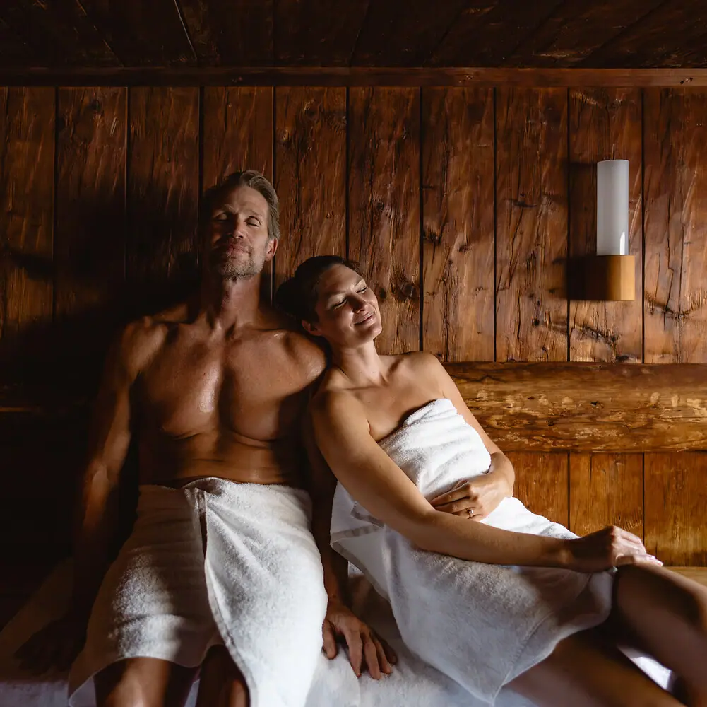 A man and a woman in a sauna.