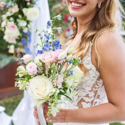A woman holding a bouquet of flowers.