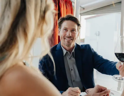 Restaurant Belvedere A man in a suit smiles at a woman.