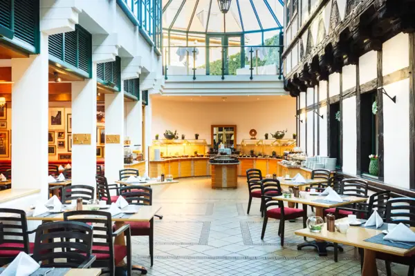 A restaurant with tables and chairs.