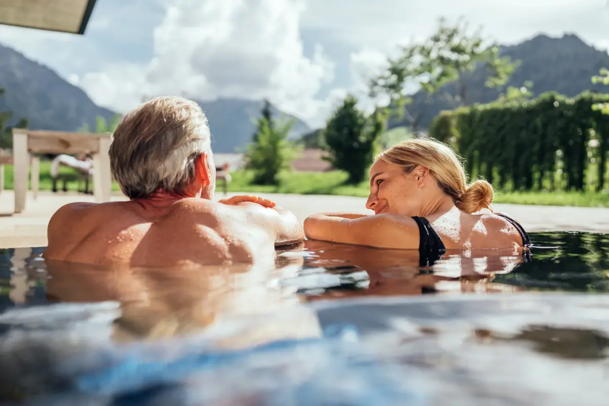 A man and a woman in a swimming pool.