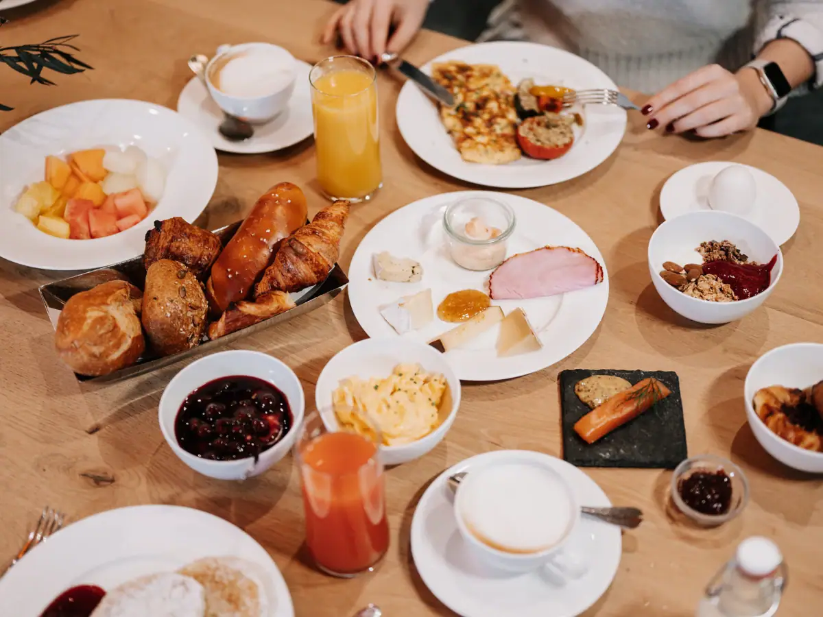 Breakfast A table full of diverse dishes and tableware.