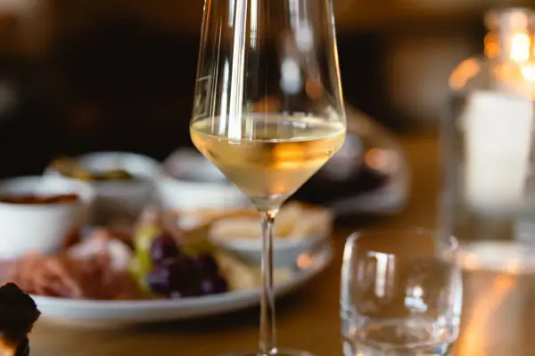 A wine glass on a table.