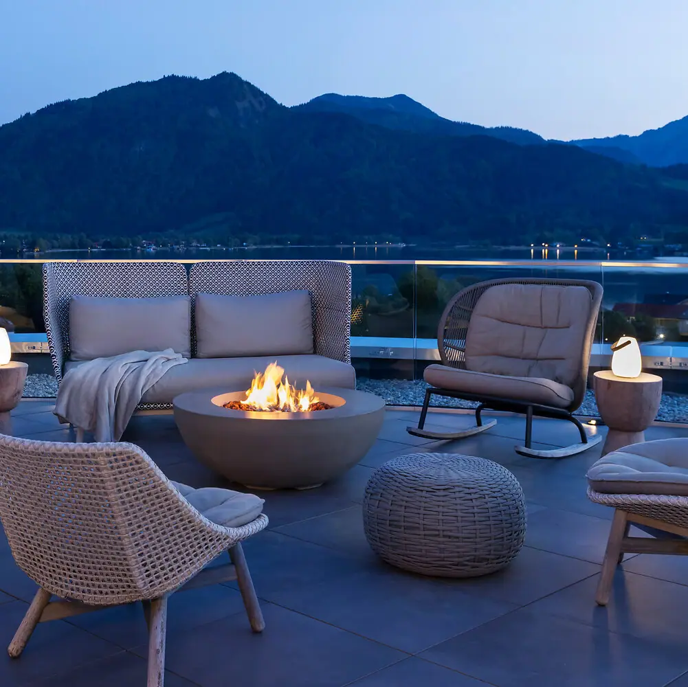 Patio with a fire pit and chairs on a deck