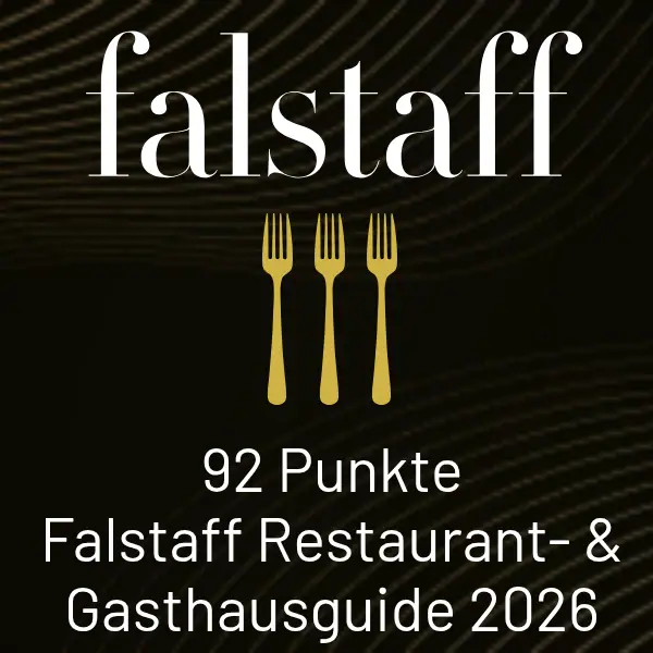 Restaurantführerkarte mit schwarzem Hintergrund und weißem Text: falstaff 91 Punkte Restaurant Guide