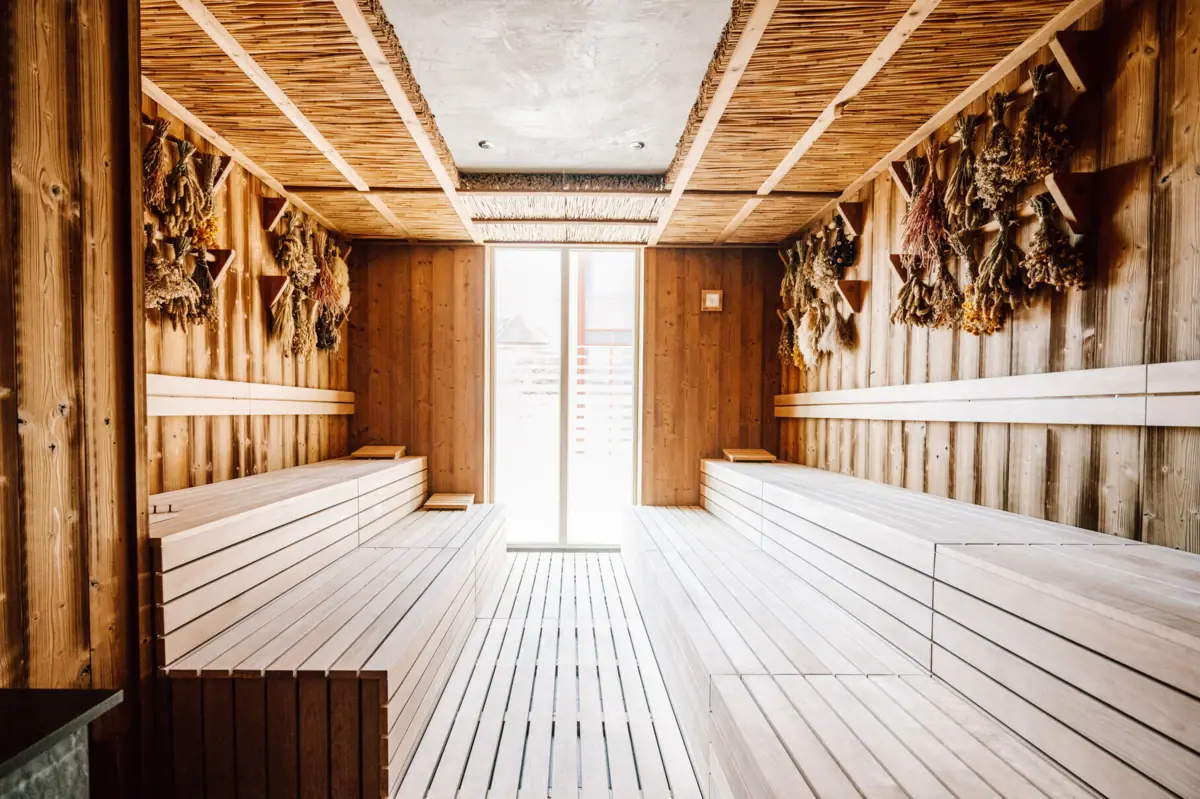 A room with wooden benches and a door.