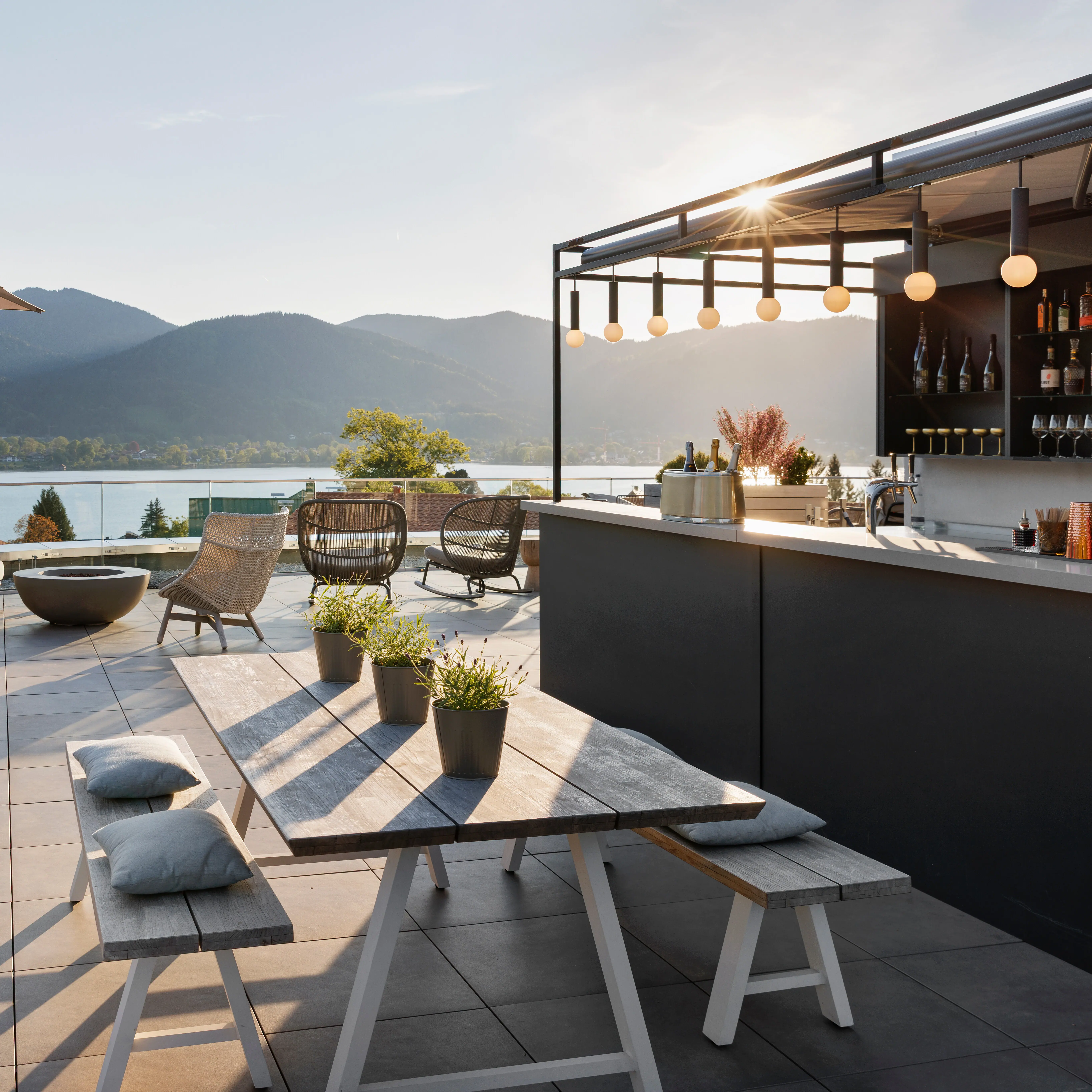 The rooftop bar at the A-ROSA Tegernsee with a view of the lake.