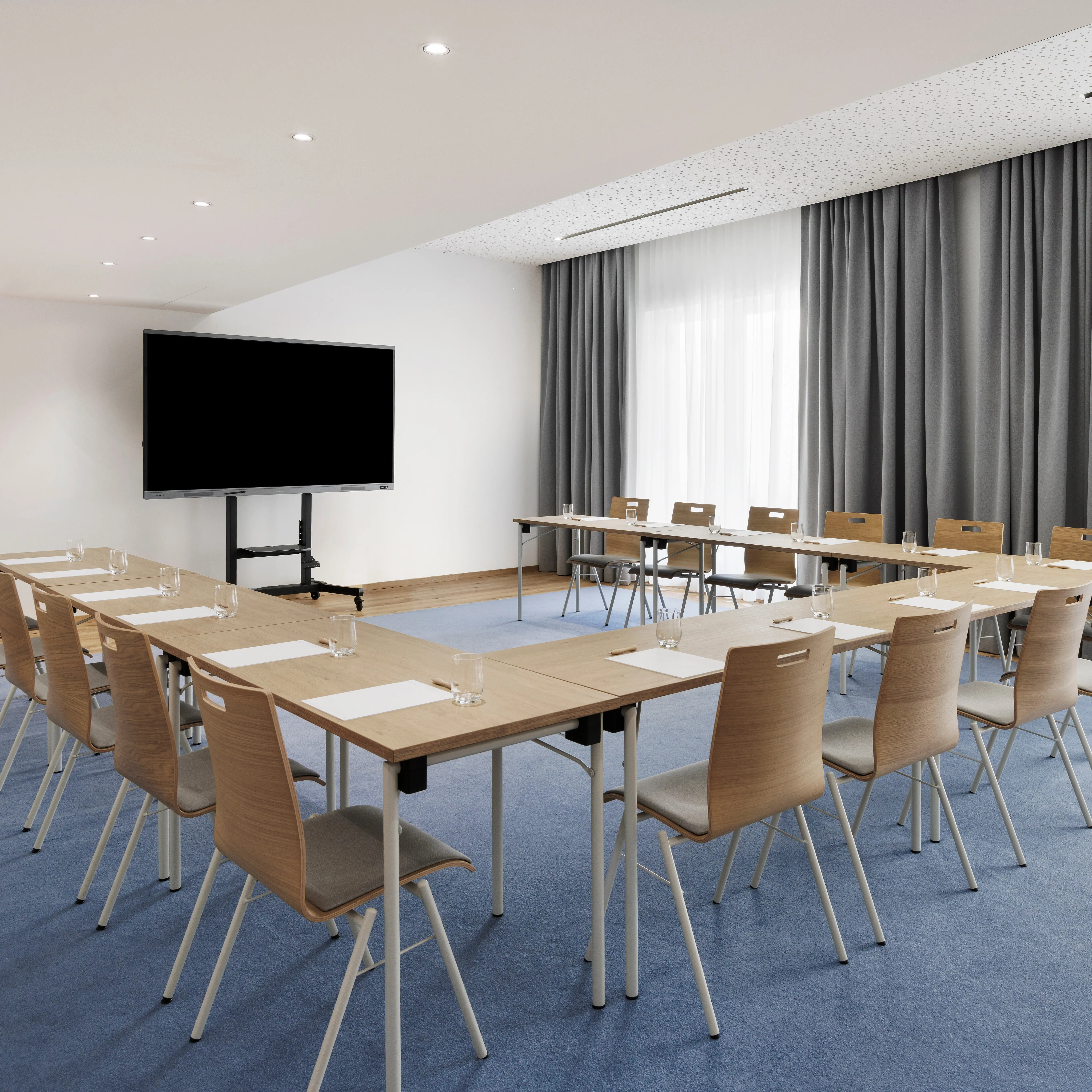 A meeting room at the A-ROSA Tegernsee with a U-shaped table.