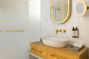 Bathroom A bathroom with a washbasin and a mirror.
