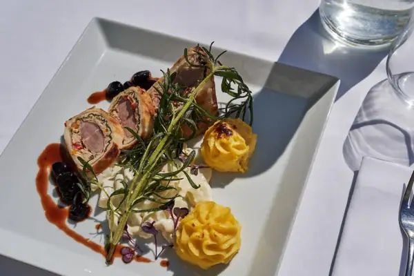 A plate of artfully arranged food on a table.