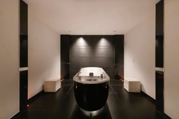 Bathtub in a stylishly designed room with modern interior elements.